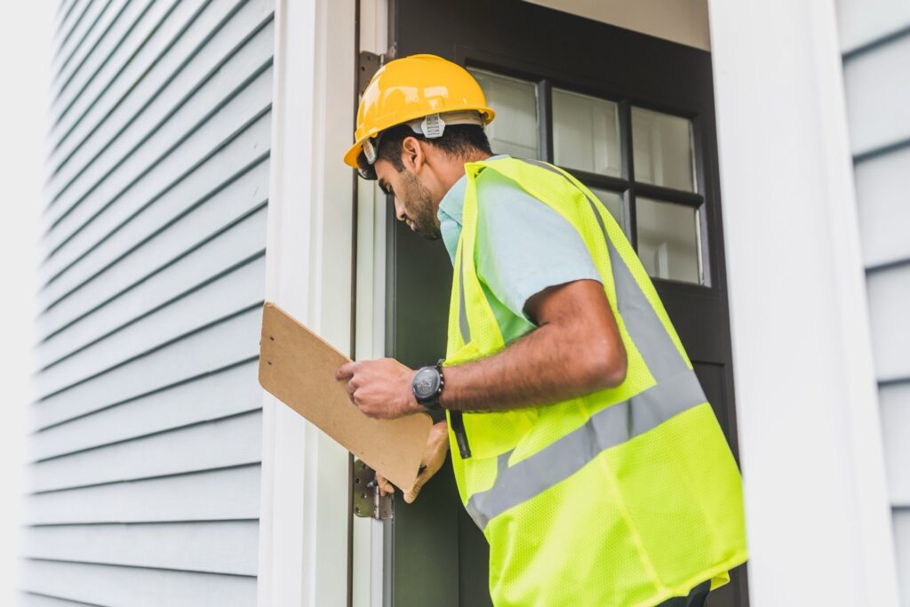 Time of Transfer inspector examining a residential septic system access point